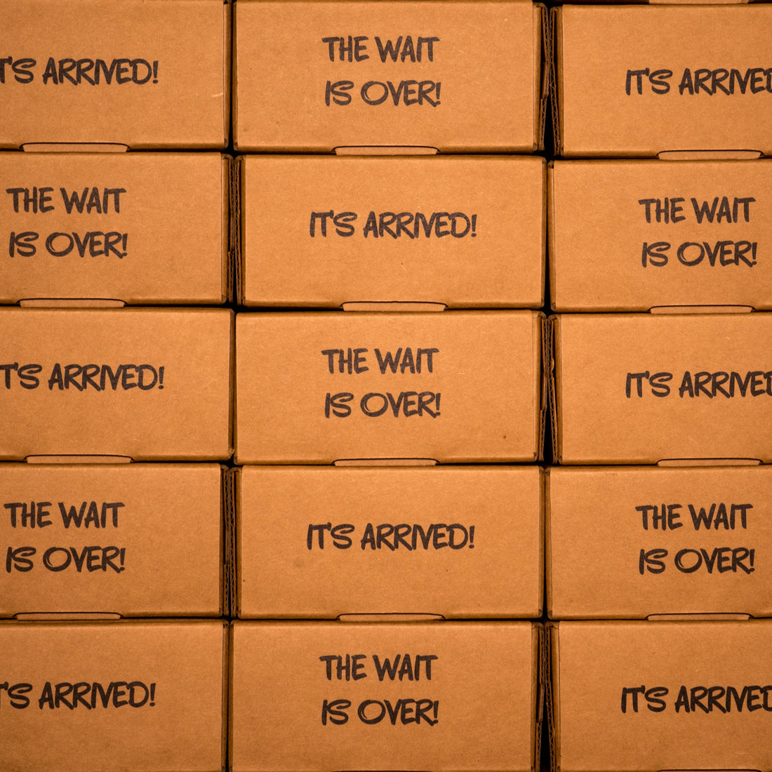 Stacked shipping boxes labeled "It's Arrived!" and "The Wait Is Over!" for Clown Nose in a Box, an anonymous prank gift
